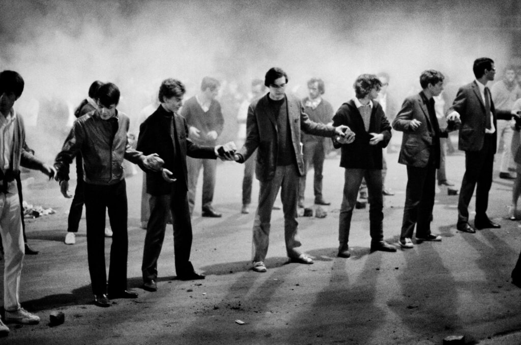 French college students linking arms at a protest in May 1968