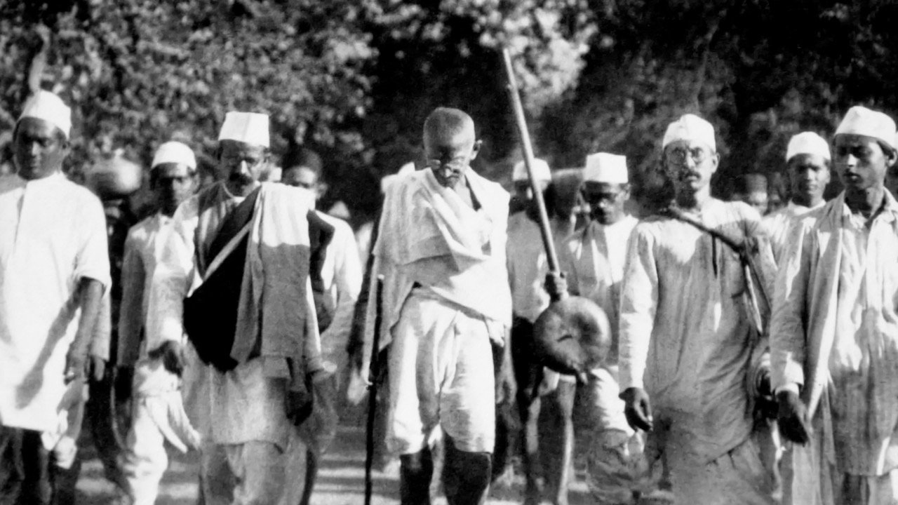 Mahatma Gandhi marching with fellow Indian Liberation activists during the Salt March